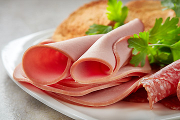 Image showing sausage slices on plate