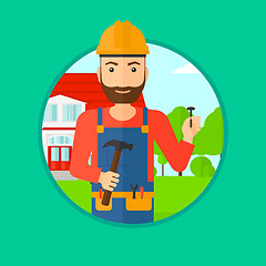Image showing Cheerful builder with hammer.