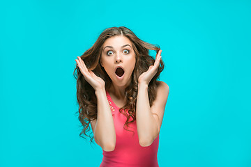 Image showing Portrait of young woman with shocked facial expression