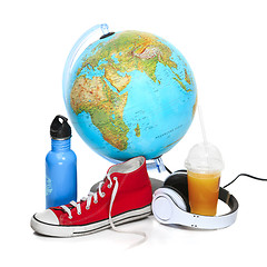 Image showing The blue globe, sneakers, thermos and headphones on white background.