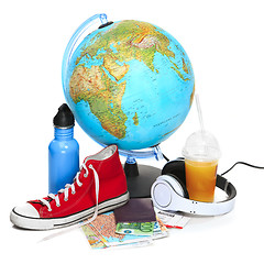 Image showing The blue globe, sneakers, thermos and headphones on white background.