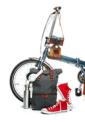 Image showing The new modern bicycle and suitcase, sneakers, thermos