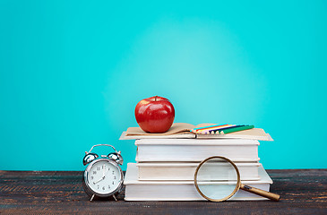 Image showing Back to School concept. Books, colored pencils and clock