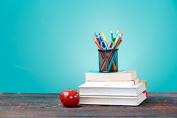 Image showing Back to School concept. School Books, colored pencils and apple