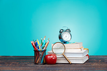 Image showing Back to School concept. Books, colored pencils and clock