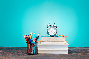 Image showing Back to School concept. Books, colored pencils and clock