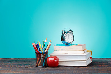 Image showing Back to School concept. Books, colored pencils and clock