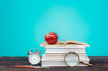 Image showing Back to School concept. Books, colored pencils and clock