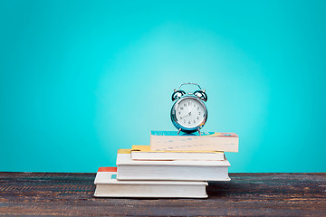 Image showing Back to School concept. Books, colored pencils and clock