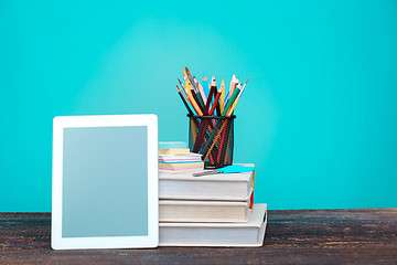 Image showing Back to School concept. Books, colored pencils and laptop
