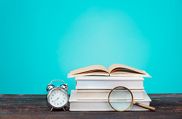 Image showing Back to School concept. Books, colored pencils and clock