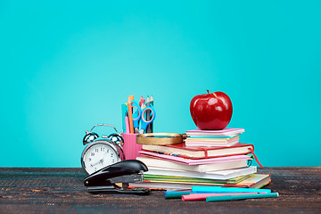 Image showing Back to School concept. Books, colored pencils and clock