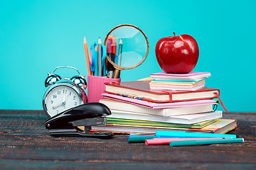 Image showing Back to School concept. Books, colored pencils and clock