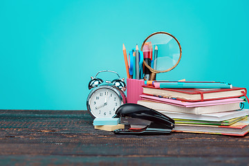 Image showing Back to School concept. Books, colored pencils and clock