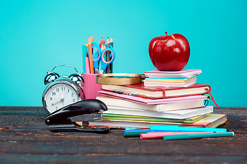 Image showing Back to School concept. Books, colored pencils and clock