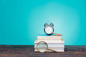 Image showing Back to School concept. Books, colored pencils and clock