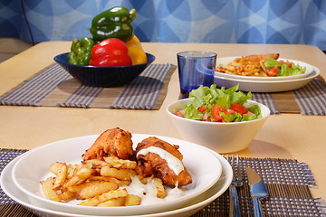 Image showing French fries and chicken