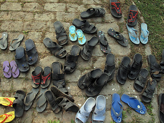 Image showing Shoes in front of the Catholic Church in India in all the temples enters barefoot