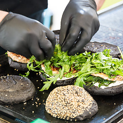 Image showing Beef burgers ready to serve on food stall.