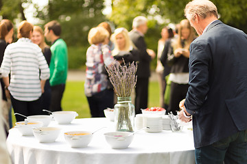 Image showing Banquet lunch break at conference meeting on hotel terrace.