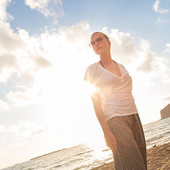 Image showing Relaxed Happy Woman Enjoying Sun on Vacations.