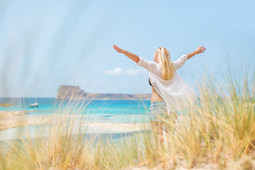 Image showing Free Happy Woman Enjoying Sun on Vacations.