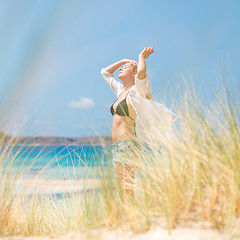 Image showing Free Happy Woman Enjoying Sun on Vacations.