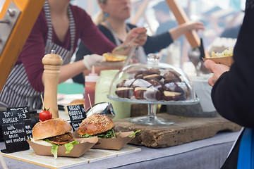 Image showing Vegetarian burgers being served on street food stall