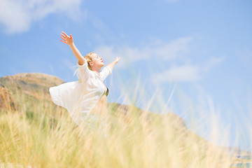 Image showing Free Happy Woman Enjoying Sun on Vacations.