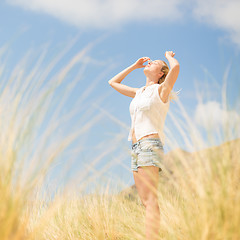 Image showing Free Happy Woman Enjoying Sun on Vacations.