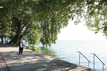 Image showing Lady posing near lake