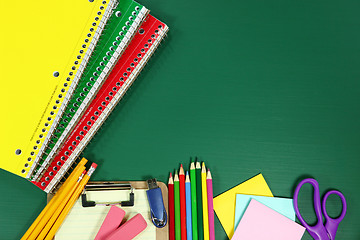 Image showing School Supplies on Blank Chalkboard