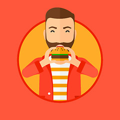 Image showing Man eating hamburger.