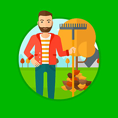 Image showing Man raking autumn leaves.