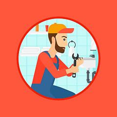 Image showing Plumber fixing sink pipe with wrench.