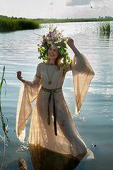 Image showing Beautiful sad woman with flower wreath