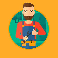 Image showing Cheerful repairman with spanner.