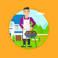 Image showing Man cooking meat on barbecue grill.