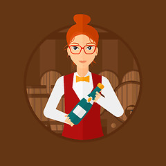 Image showing Waitress holding bottle in wine cellar.