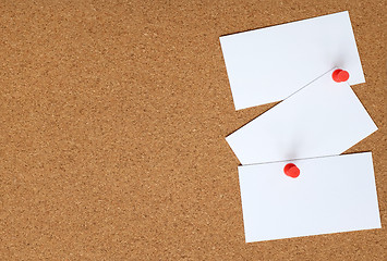 Image showing Cork board with three white cards pinned to it