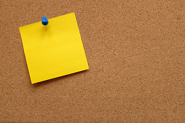 Image showing Yellow note paper pinned to a cork board