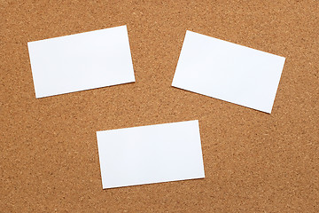 Image showing Three blank cards on a cork board