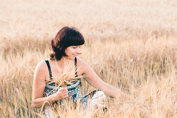 Image showing Middle aged beauty woman in barley field