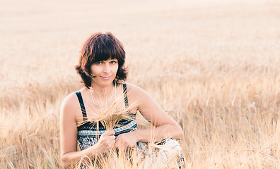 Image showing Middle aged beauty woman in barley field