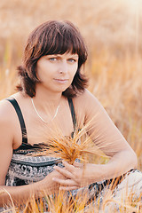 Image showing Middle aged beauty woman in barley field