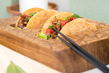 Image showing fresh mexican taco shells with beef and vegetables
