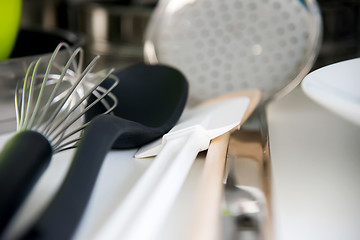 Image showing Various tableware on shelf in the kitchen