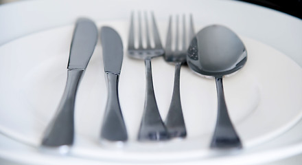 Image showing Fork, Spoon and Table Knife on the white background