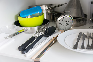 Image showing Various tableware on shelf in the kitchen