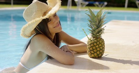 Image showing Pretty trendy young woman in a summer pool